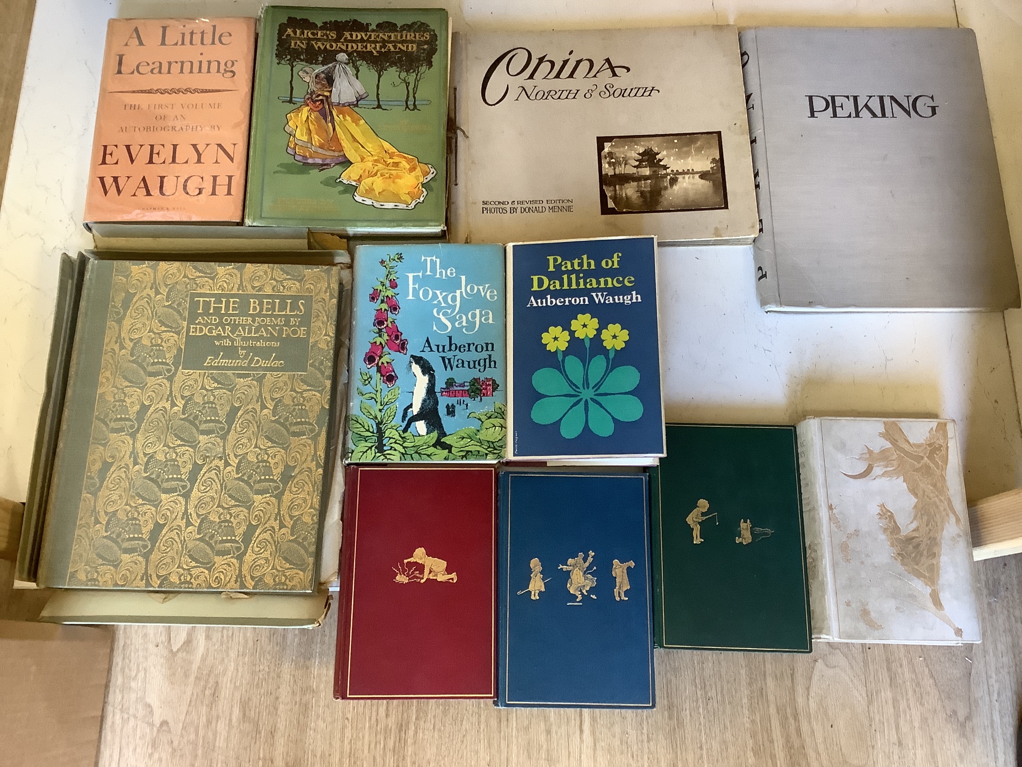 A quantity of books, to include The Bells by Edgar Allan Poe, Alice’s Adventures in Wonderland published by Thomas Nelson and Sons, Winnie-The-Pooh fifth editions and others (11)